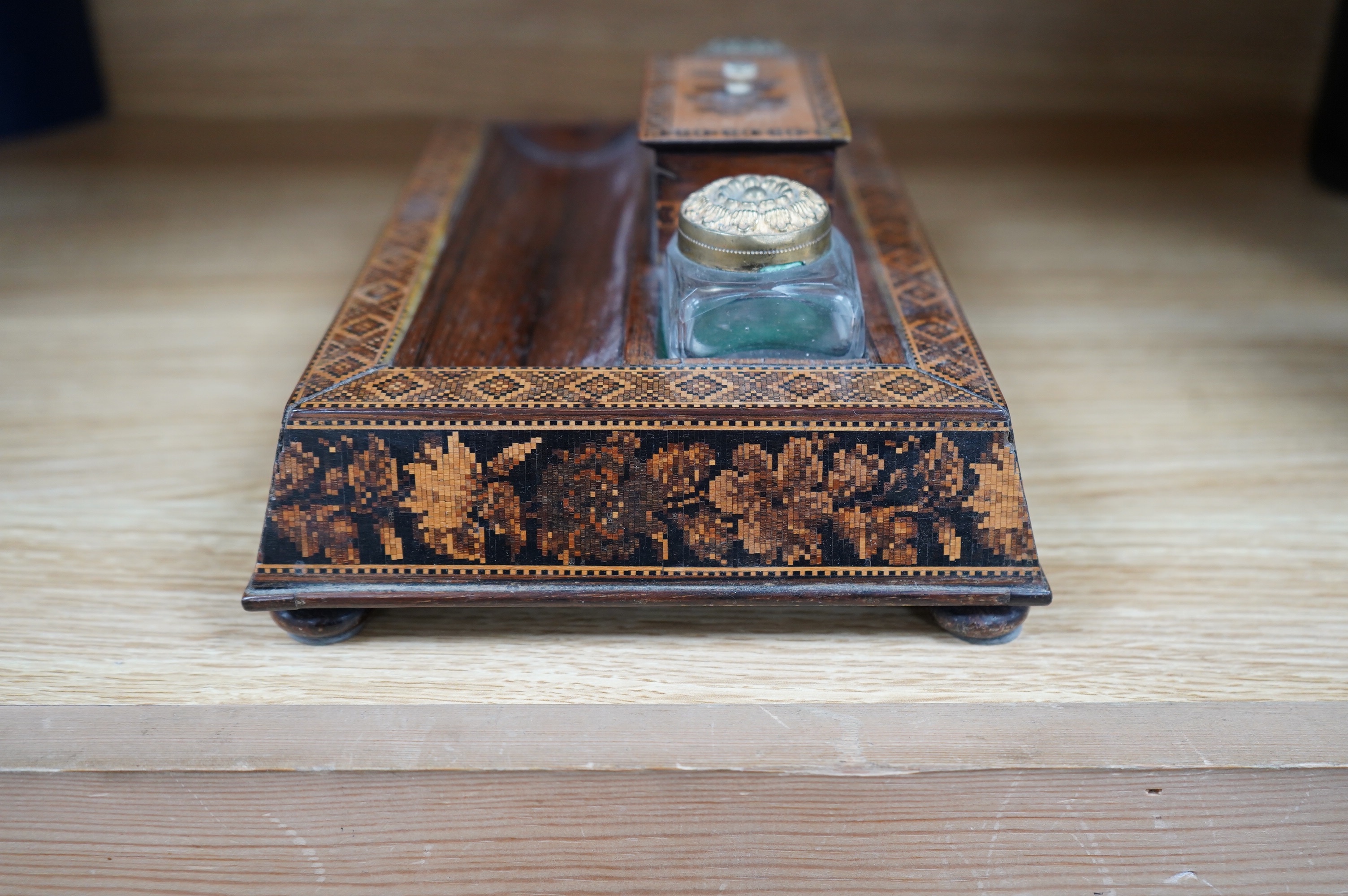 A Tunbridgeware rosewood inkstand with two glass ink bottles, 26cm wide. Condition - fair